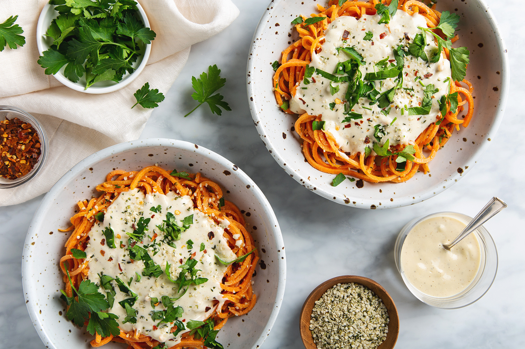Healthy Sweet Potato Noodles with 5-Minute Vegan Alfredo Sauce! You're going to want to put this sauce on everything! | picklesnhoney.com #sweetpotato #noodles #vegan #alfredo #sauce #recipe #glutenfree #noodles #lunch #dinner