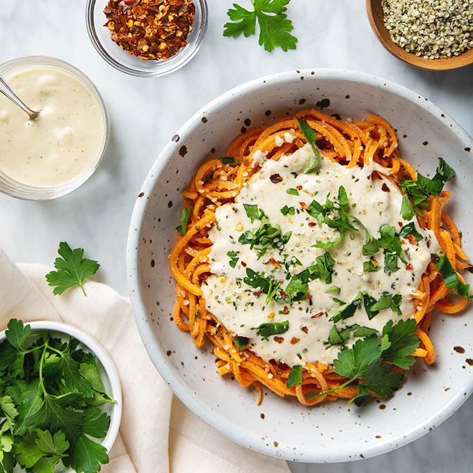 Healthy Sweet Potato Noodles with 5-Minute Vegan Alfredo Sauce! You're going to want to put this sauce on everything! | picklesnhoney.com #sweetpotato #noodles #vegan #alfredo #sauce #recipe #glutenfree #noodles #lunch #dinner